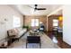 Bright living room with exposed brick, stylish furnishings, and ample natural light at 1546 W Culver St, Phoenix, AZ 85007