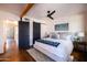 Bright main bedroom with dark sliding closet door and ceiling fan at 1546 W Culver St, Phoenix, AZ 85007