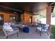 Comfortable outdoor seating area with brick columns and dark ceiling at 1546 W Culver St, Phoenix, AZ 85007