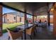 Spacious covered patio featuring a dining table and multiple seating areas at 1546 W Culver St, Phoenix, AZ 85007