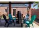 Covered patio area with colorful chairs and a metal fire pit at 1546 W Culver St, Phoenix, AZ 85007