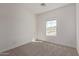 Bedroom with carpet flooring, a window, and neutral walls at 1564 N Pueblo Dr, Apache Junction, AZ 85120