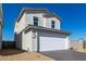 Elegant house featuring an attached garage and low-water desert landscape at 1564 N Pueblo Dr, Apache Junction, AZ 85120