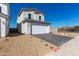 Stylish two story home with a garage and desert rock landscaping at 1564 N Pueblo Dr, Apache Junction, AZ 85120