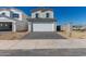 Two story home featuring a spacious garage and neutral color scheme at 1564 N Pueblo Dr, Apache Junction, AZ 85120