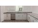 Kitchen featuring granite countertops, stainless steel appliances, white cabinets, and modern fixtures at 1564 N Pueblo Dr, Apache Junction, AZ 85120