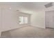 Bright, carpeted living room with recessed lighting and two windows, creating a welcoming atmosphere at 1564 N Pueblo Dr, Apache Junction, AZ 85120