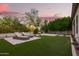 Private backyard with artificial turf and lounge chairs, perfect for enjoying the outdoor space and relaxing at 18025 N 65Th Pl, Phoenix, AZ 85054