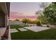 Large backyard with artificial grass, lounge chairs, and block fencing at 18025 N 65Th Pl, Phoenix, AZ 85054