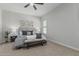 Cozy bedroom featuring a ceiling fan, neutral walls, plush carpet, and inviting decor for a restful atmosphere at 18025 N 65Th Pl, Phoenix, AZ 85054