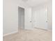Neutral bedroom with carpet floors, white trim, and closet with white sliding doors at 18025 N 65Th Pl, Phoenix, AZ 85054