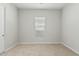 Neutral bedroom with a window and carpet at 18025 N 65Th Pl, Phoenix, AZ 85054