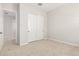 Neutral bedroom features carpet and a closet with white sliding doors at 18025 N 65Th Pl, Phoenix, AZ 85054