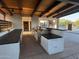 Outdoor grill area with stainless steel grills, countertops, and access to the community pool at 18025 N 65Th Pl, Phoenix, AZ 85054