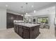 Modern kitchen island offers seating and flows seamlessly into the living area at 18025 N 65Th Pl, Phoenix, AZ 85054