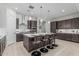 Spacious kitchen with a center island, stainless steel appliances, and ample cabinet space at 18025 N 65Th Pl, Phoenix, AZ 85054