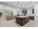 Open-concept kitchen and living room create a welcoming atmosphere for gatherings at 18025 N 65Th Pl, Phoenix, AZ 85054
