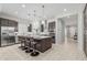 Bright kitchen with a large island, pendant lights, and stainless steel appliances at 18025 N 65Th Pl, Phoenix, AZ 85054