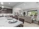 Inviting open-concept living space with a modern kitchen, dining area, and comfortable seating at 18025 N 65Th Pl, Phoenix, AZ 85054
