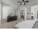 Calming main bedroom with a dresser, soft carpet, and view to living areas, creating a relaxed retreat at 18025 N 65Th Pl, Phoenix, AZ 85054