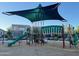 Community playground offers diverse play equipment, slides, and covered areas for recreation at 18025 N 65Th Pl, Phoenix, AZ 85054