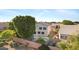 A backyard view of the house and pool area showcasing privacy and mature trees at 1975 E Chilton Dr, Tempe, AZ 85283
