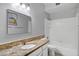 Bathroom featuring granite counters, large mirror, and shower-tub combo at 1975 E Chilton Dr, Tempe, AZ 85283