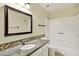 Well-lit bathroom featuring a vanity with decorative tile, framed mirror, and a shower-tub combo at 1975 E Chilton Dr, Tempe, AZ 85283