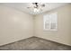 Simple bedroom with neutral carpet, ceiling fan, and plantation shutters to maximize natural light at 1975 E Chilton Dr, Tempe, AZ 85283