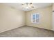 Bedroom featuring carpet flooring and large window with shutter blinds at 1975 E Chilton Dr, Tempe, AZ 85283