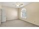 Clean bedroom with carpet, ceiling fan, and plantation shutters allowing for natural light and view at 1975 E Chilton Dr, Tempe, AZ 85283