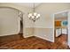 Dining area with hardwood floors near the kitchen and staircase at 1975 E Chilton Dr, Tempe, AZ 85283