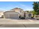 Charming two-story home featuring a three-car garage and a well-maintained, drought-resistant front yard at 1975 E Chilton Dr, Tempe, AZ 85283