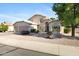 Beautiful two-story home with desert landscaping, a three-car garage, and well-manicured front yard at 1975 E Chilton Dr, Tempe, AZ 85283