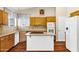 Bright kitchen featuring tile counters, a center island, and stainless steel appliances at 1975 E Chilton Dr, Tempe, AZ 85283