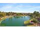 Scenic view of a serene lake, surrounding lush landscape and attractive homes at 1975 E Chilton Dr, Tempe, AZ 85283