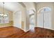 Spacious living room with hardwood floors and an arched doorway at 1975 E Chilton Dr, Tempe, AZ 85283