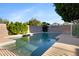Backyard showcasing a sparkling pool surrounded by mature trees and a well-maintained block wall at 1975 E Chilton Dr, Tempe, AZ 85283