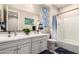 Bathroom with a double sink vanity, a toilet, a shower and blue and white accessories at 19858 W San Juan Ave, Litchfield Park, AZ 85340