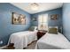 Twin bedroom featuring two twin beds, a chandelier, and plantation shutters at 19858 W San Juan Ave, Litchfield Park, AZ 85340