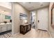 Welcoming entryway with modern decor, stylish lighting, and access to the bathroom and bedroom at 19858 W San Juan Ave, Litchfield Park, AZ 85340