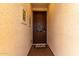 Inviting entryway with textured walls and an ornamental front door at 19858 W San Juan Ave, Litchfield Park, AZ 85340