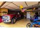 Spacious garage with epoxy floors and a full-size truck parked inside, providing ample storage and parking space at 19858 W San Juan Ave, Litchfield Park, AZ 85340