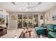 Bright living room with lots of natural light, decorative ceiling fan and wood-look flooring at 19858 W San Juan Ave, Litchfield Park, AZ 85340