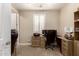 Bright office featuring a ceiling fan, plantation shutters, and traditional desk at 19858 W San Juan Ave, Litchfield Park, AZ 85340