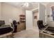 Bright office featuring a ceiling fan, carpeting, and a traditional desk at 19858 W San Juan Ave, Litchfield Park, AZ 85340