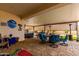 Enjoy outdoor living on this covered patio with comfortable seating and a relaxing spa for year-round enjoyment at 19858 W San Juan Ave, Litchfield Park, AZ 85340