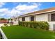 Home exterior with lush artificial turf and a modern black metal fence enclosing the backyard space at 2242 E Palm Ln, Phoenix, AZ 85006