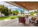 Charming backyard patio space with comfortable seating and a lush green lawn at 2242 E Palm Ln, Phoenix, AZ 85006