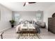 Bright bedroom featuring a stylishly dressed bed, plush area rug, and ample natural light from the windows at 2242 E Palm Ln, Phoenix, AZ 85006